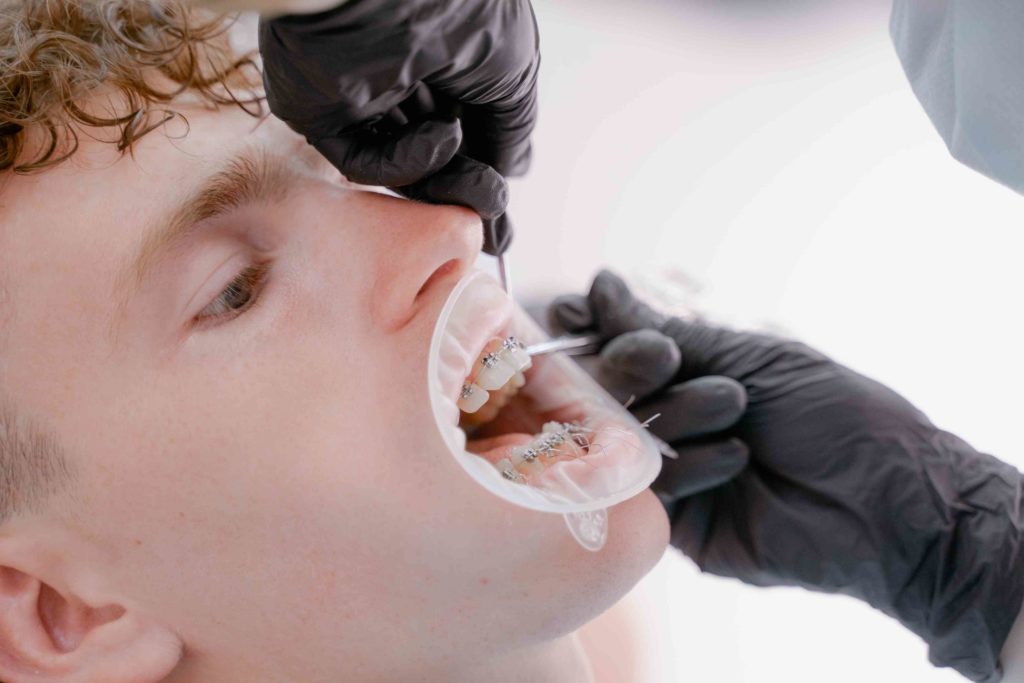a dentist examining the mouth of a patient